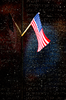 A Small Flag Reflects Against Names Inscribed On The Vietnam Veterans Memorial. Image